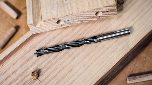Brad point wood drill bit on timber, ideal for precise woodworking tasks